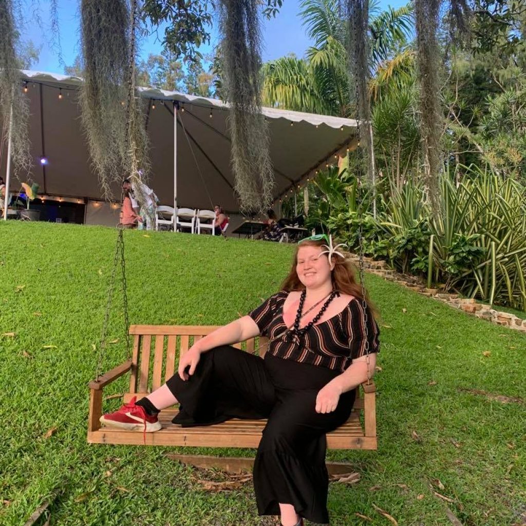 Me posing on swinging bench