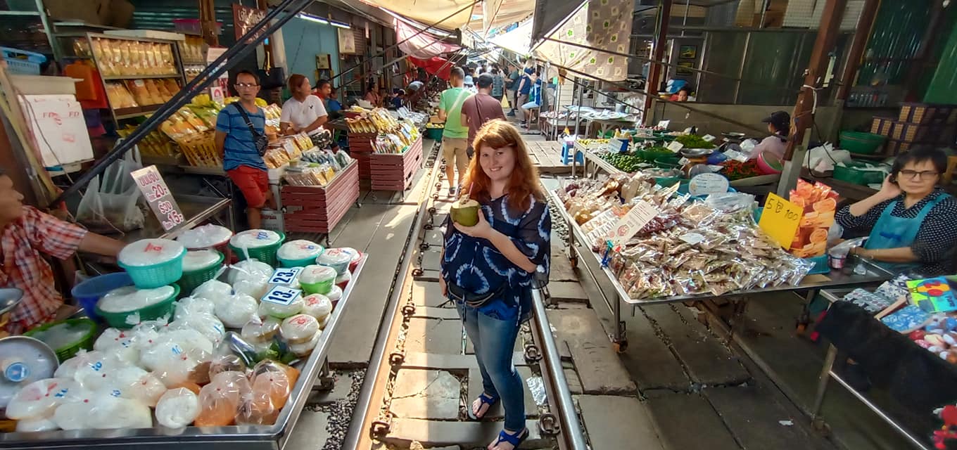 Me standing on the tracks in Maeklong Market.