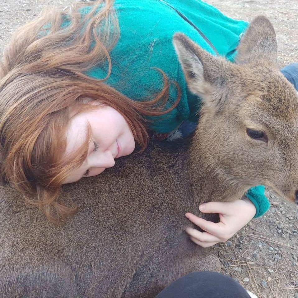 Me holding a deer in Nara