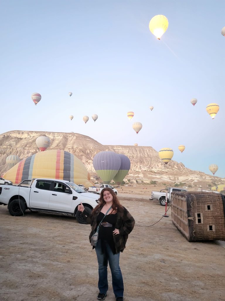 me standing in front of hot air balloons taking off