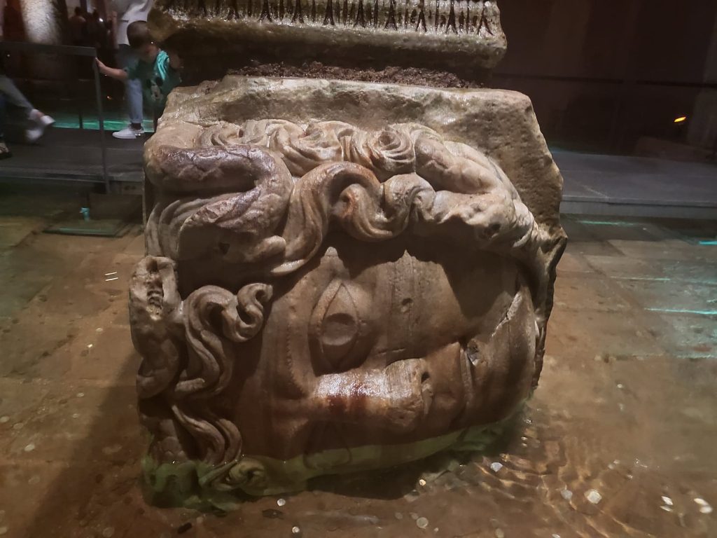 Medusa head carved into a column