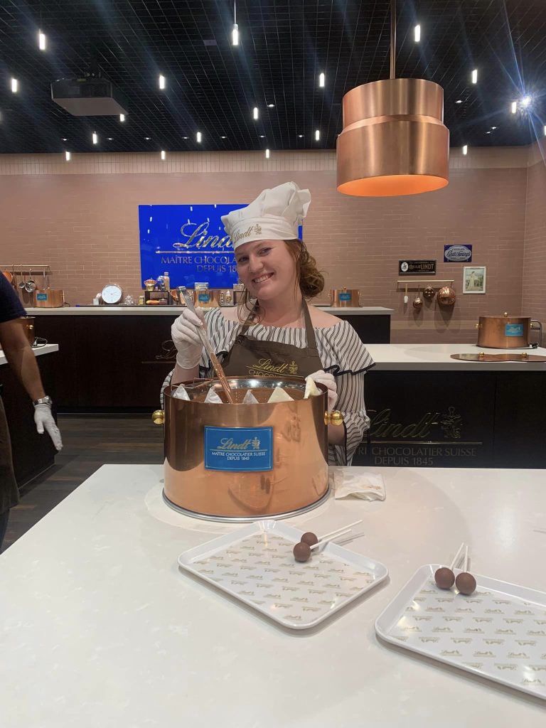 Me stirring chocolate at the Lindt museum